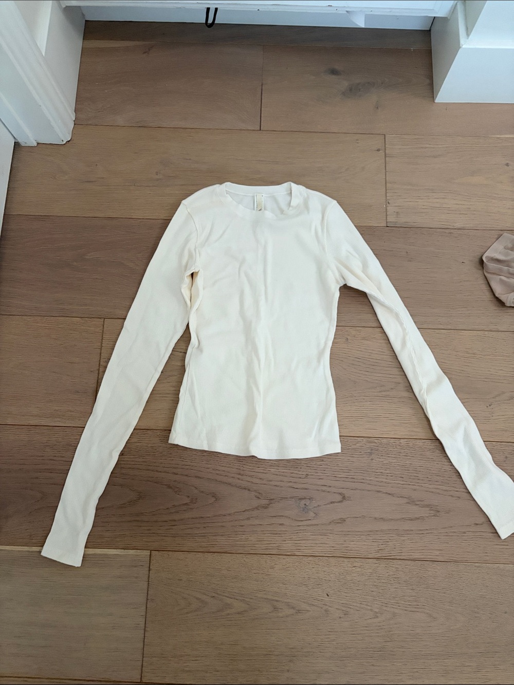 SKIMS Long-Sleeve Crewneck Top in Cream